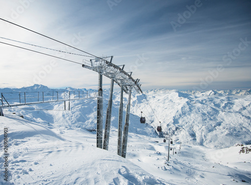 Cable car lift on an alpine mountainside in mountain range
