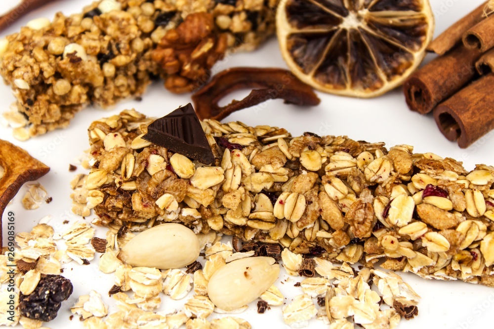Muesli bar on a white background. Healthy food. Protein diet. Healthy sweetness. Oatmeal and dried fruits. Muesli bar on a white background. Healthy food. Protein diet. Healthy sweetness. Oatmeal and dried fruits.