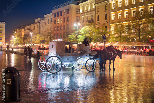 A coach in the rainy Krakow photo