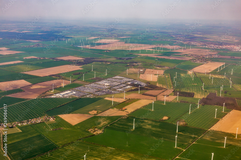 Aerial view over wind mill turbine farm