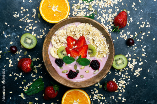 Yogurt smoothie bowl. Vegetarian healthy food (berries, yogurt, muesli, fruit)