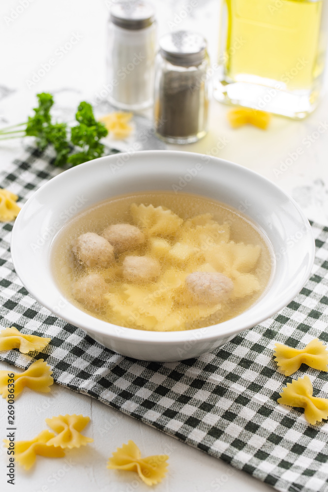 Chicken bouillon with meatballs and farfalle Chicken bouillon with meatballs and farfalle