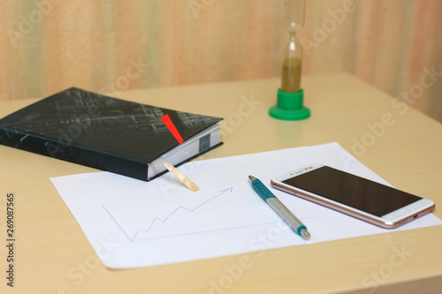 Work schedule with diary, pen and mobile phone