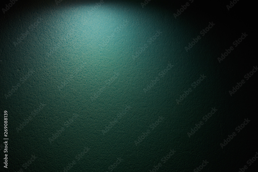 A wide beam of dark gray on a black background