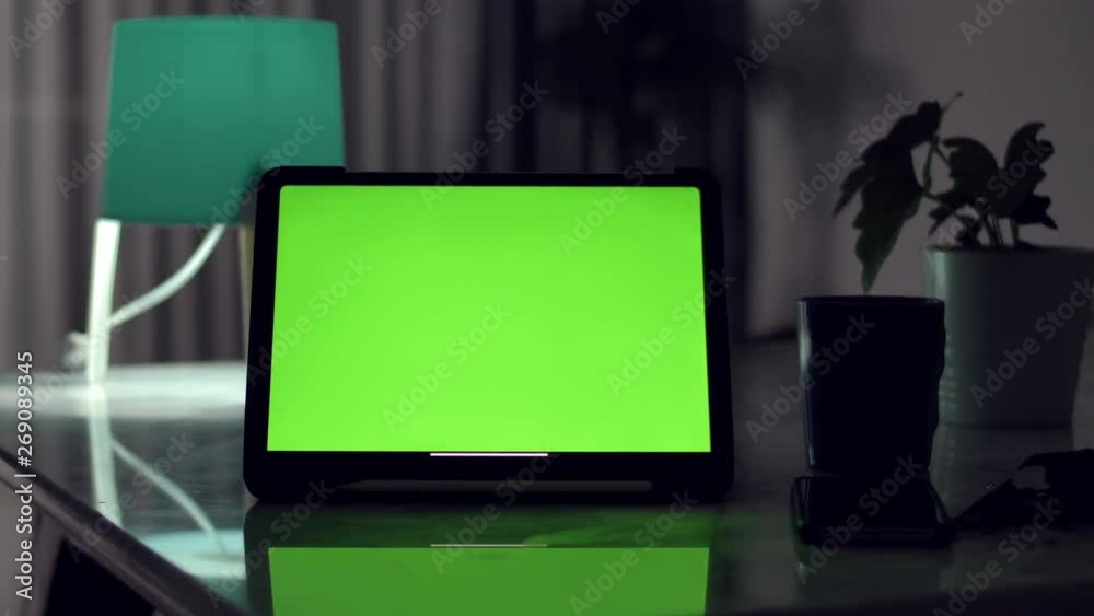 Dolly shot of Tablet computer with green screen chroma key. Dolly shot of Tablet computer with green screen chroma key.
