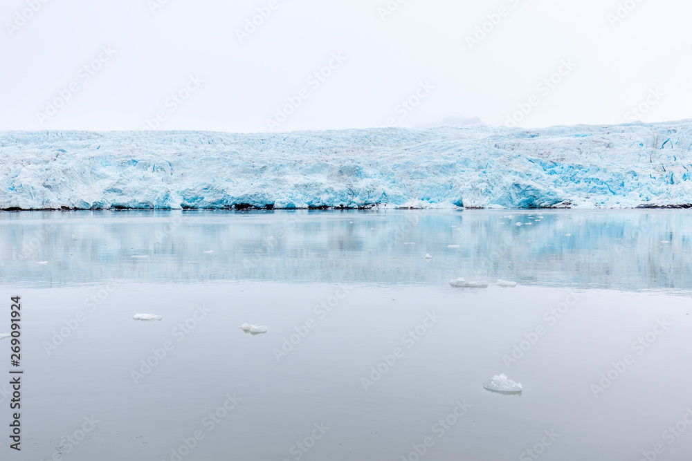 At the edge of the glacier Nordenskiöldbreen near Pyramiden, on the