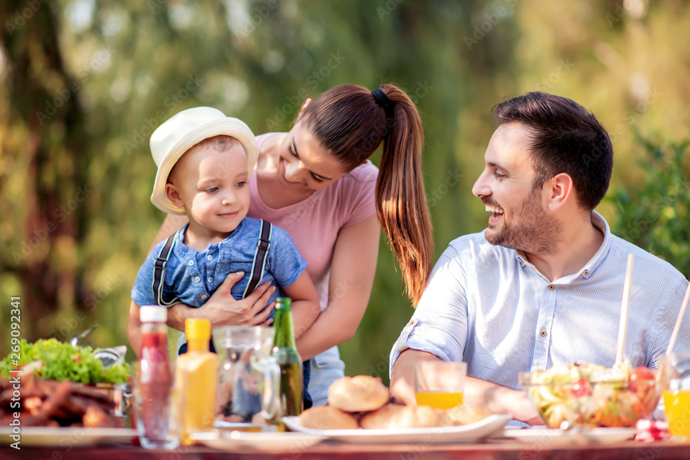 Happy family having a barbecue in summer Happy family having a barbecue in summer