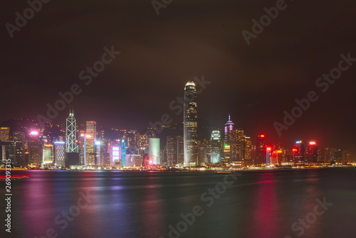 The illuminated skyscrapers along the waterfront at Victoria Harbour in Hong Kong