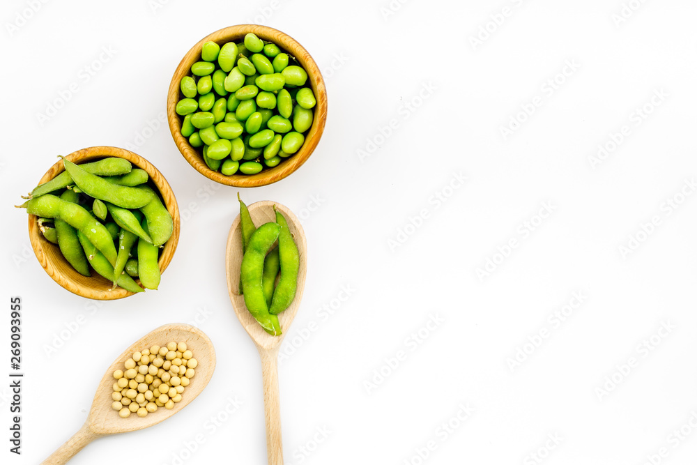 Edamame in bowl and spoon on white background top view mock up
