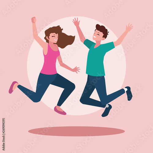 young couple celebrating with hands up