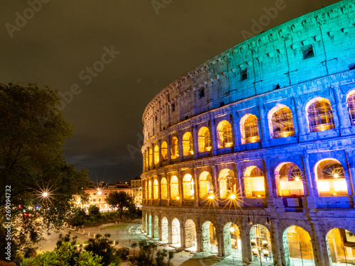 A night time picture of Oval amphitheatre in the centre of the city of Rome, Italy with light and full moon