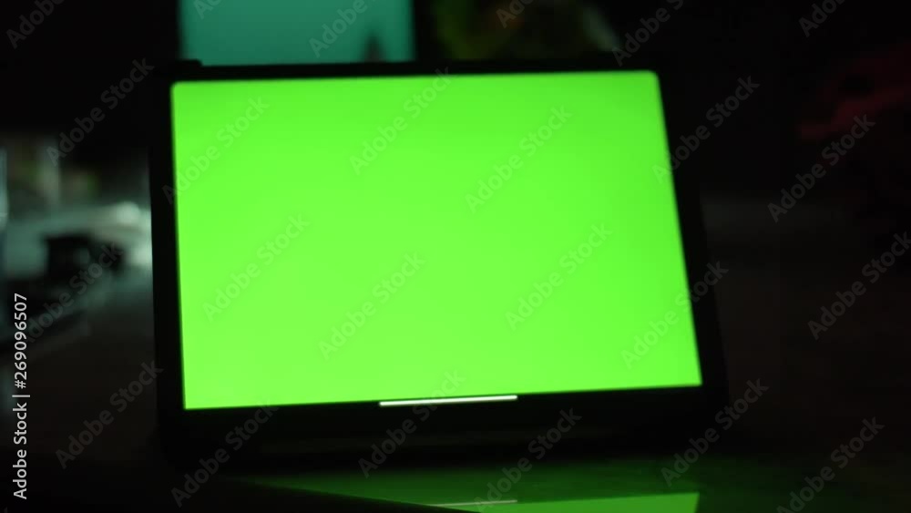 Dolly shot of Tablet computer with green screen chroma key. Dolly shot of Tablet computer with green screen chroma key.