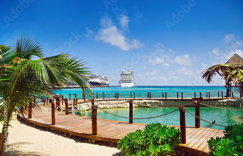 View from beach at tropical resort on cruise ships at port  © NAN