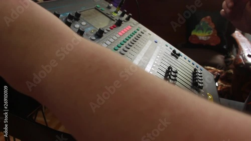 The Sound Engineer Works On A Professional Audio Mixer