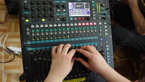 The Sound Engineer Works On A Professional Audio Mixer