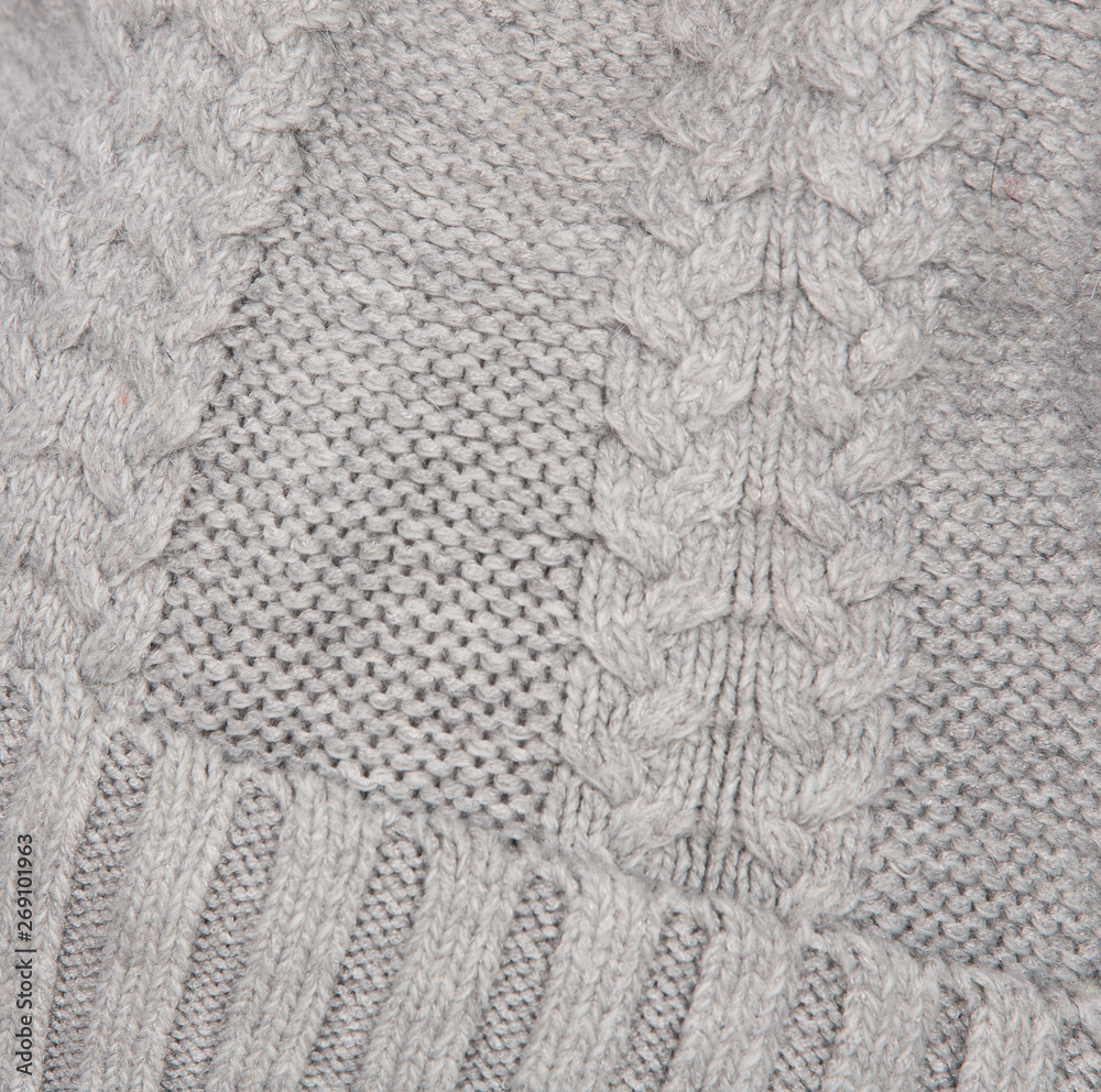 background of knitted wool threads, knitting on the cap, headdress close-up