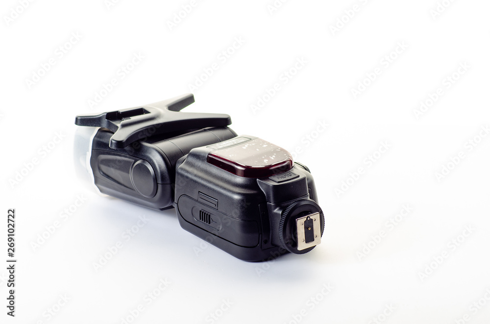 The camera flash is isolated on a white background The camera flash is isolated on a white background