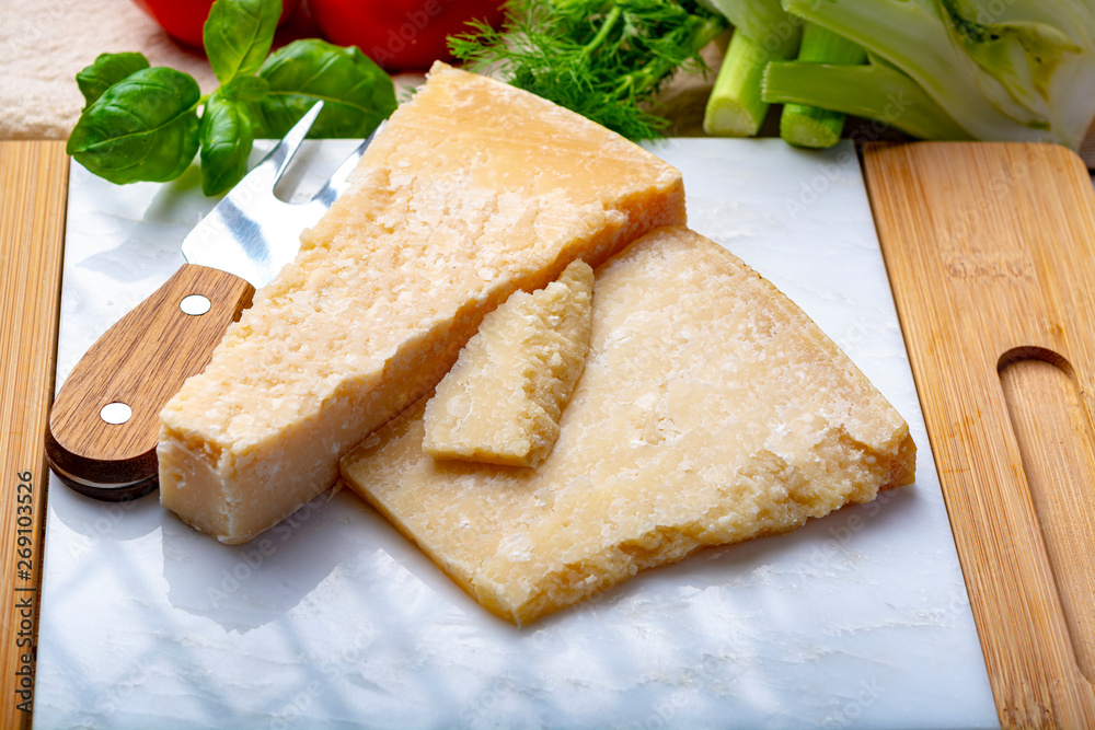 Original italian cheese, aged Parmesan cow milk cheese, pieces of Parmigiano-Reggiano Original italian cheese, aged Parmesan cow milk cheese, pieces of Parmigiano-Reggiano
