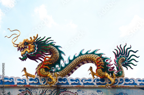 Giant grand colorful Chinese dragon isolate bright natural blue sky background