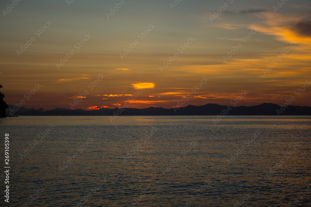 Sunrise at sea, Abel Tasman National Park, south island, New Zealand.