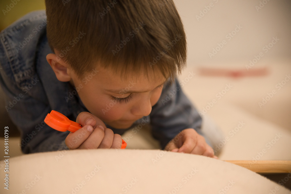 A little boy is playing the masters A little boy is playing the masters