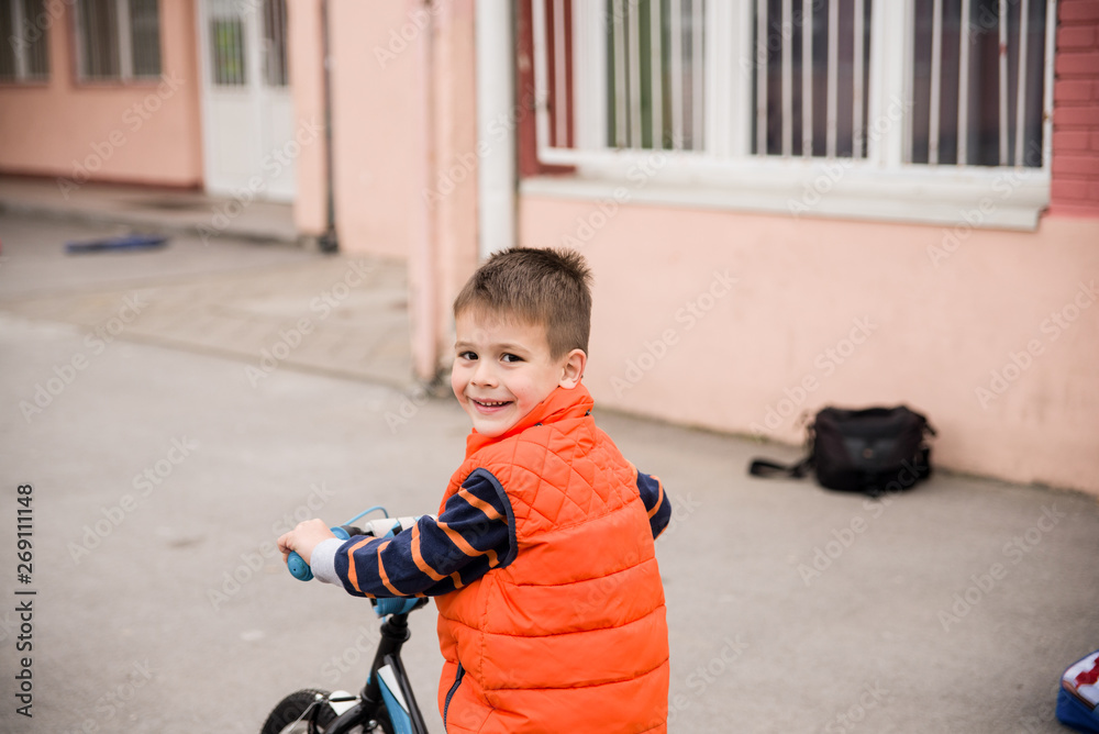 A little boy rides a bicycle A little boy rides a bicycle