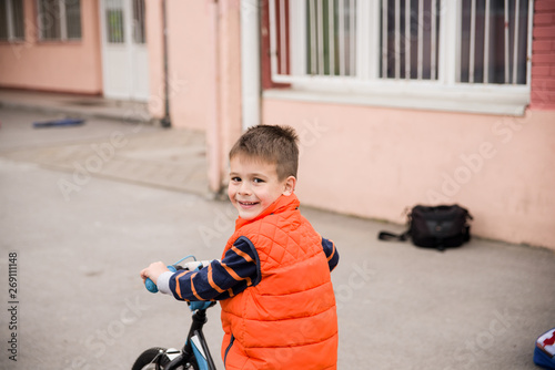  A little boy rides a bicycle