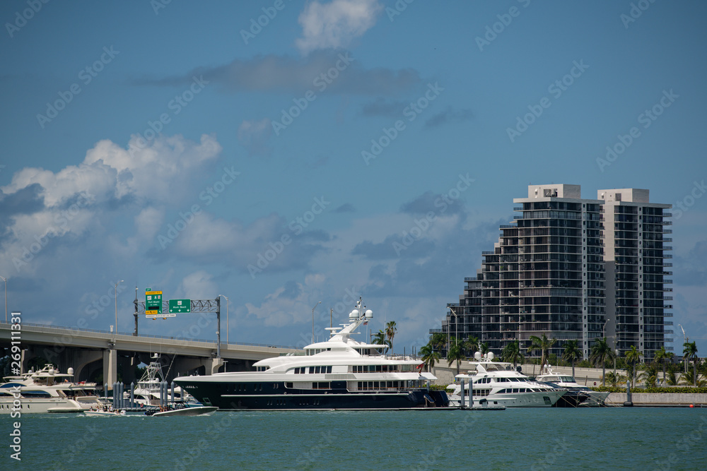 Stock photo luxury yachts in Miami by bridge