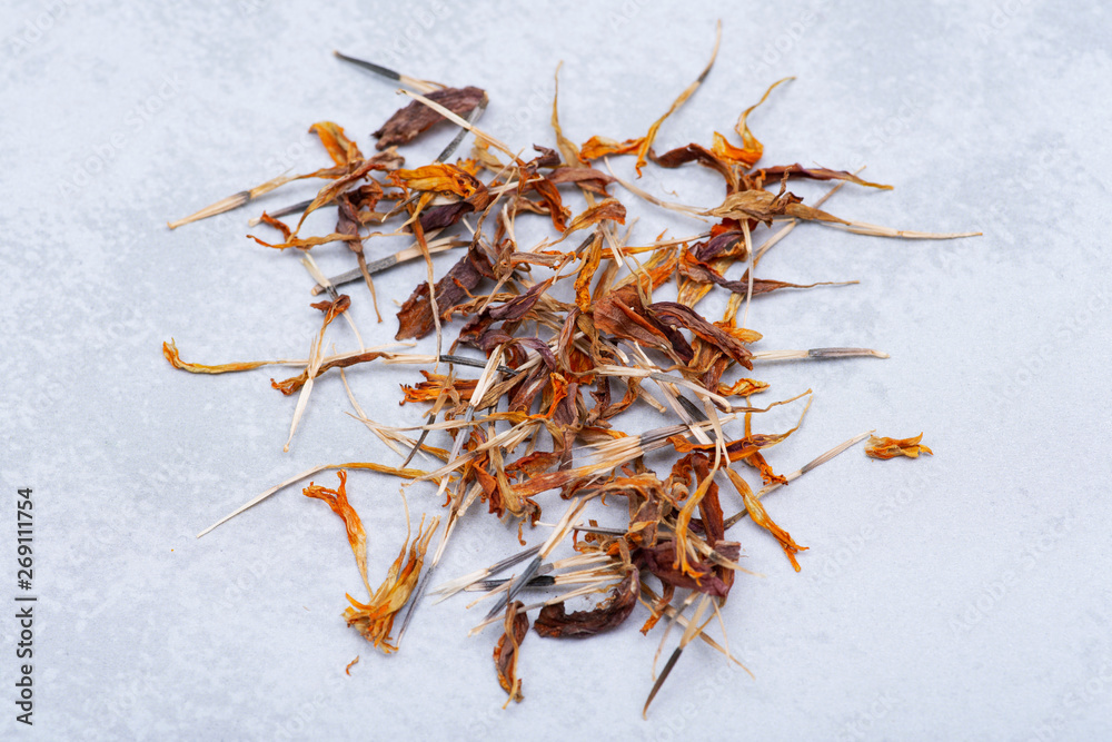 Pile of Marigold Dry Seeds (Mexican marigold, Aztec marigold, African marigold) on gray background. Tagetes erecta. Daisy family. Pile of Marigold Dry Seeds (Mexican marigold, Aztec marigold, African marigold) on gray background. Tagetes erecta. Daisy family.