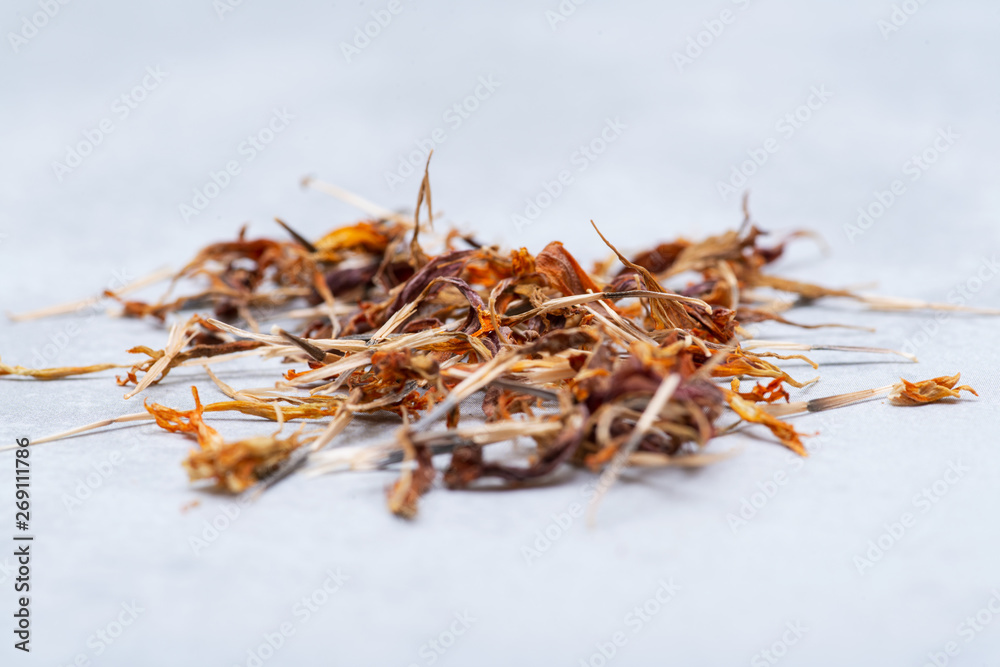 Pile of Marigold Dry Seeds (Mexican marigold, Aztec marigold, African marigold) on gray background. Tagetes erecta. Daisy family.