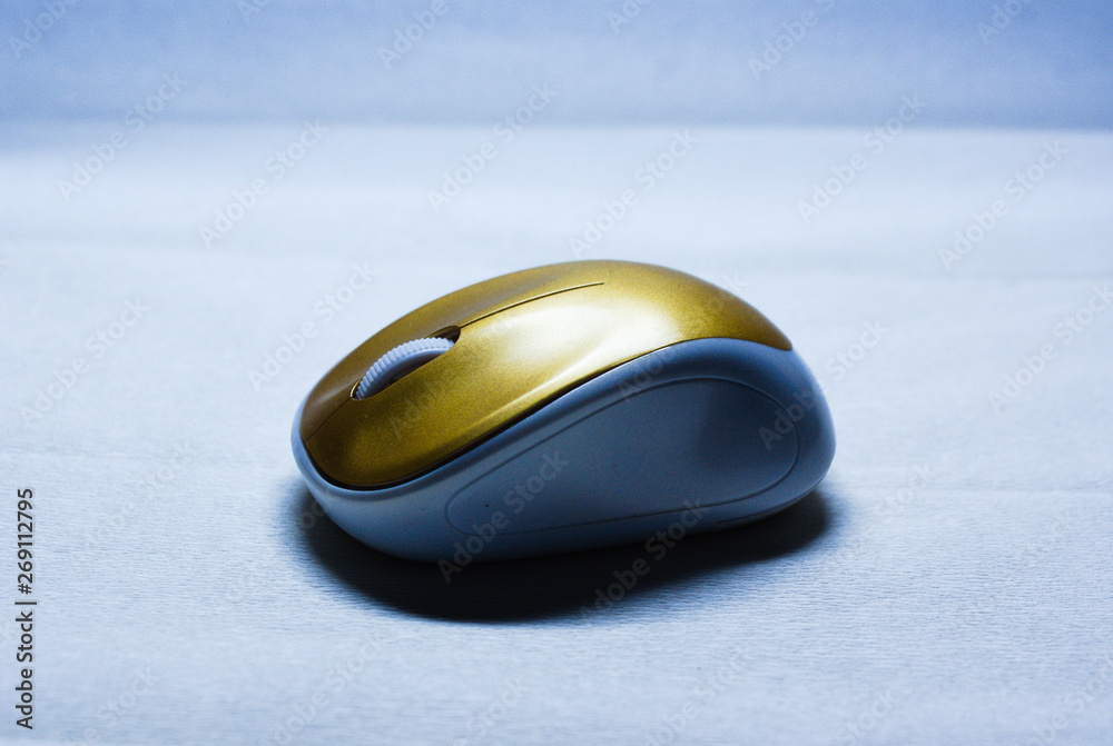 close up of a white and gold computer mouse close up of a white and gold computer mouse