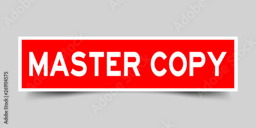 Square red sticker label in word master copy on gray background