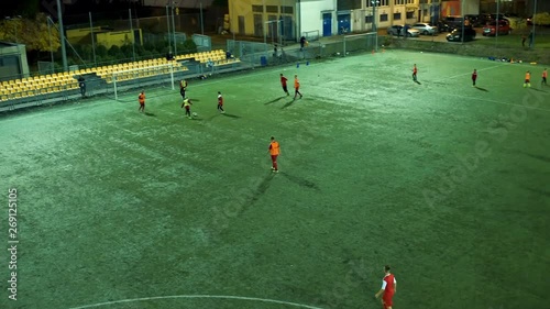 The drone flies above the football pitch.