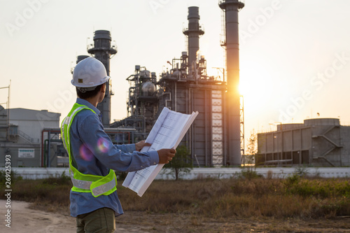 engineer discussing a new project with large industry background