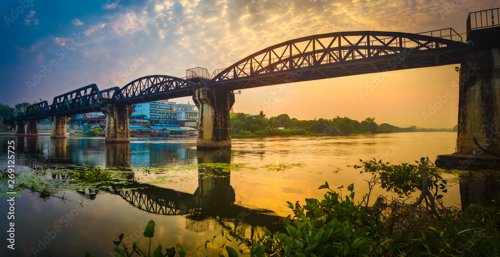 The bridge on the river Kwai at sunrise. Railway in Kanchanaburi, Thailand. Panorama