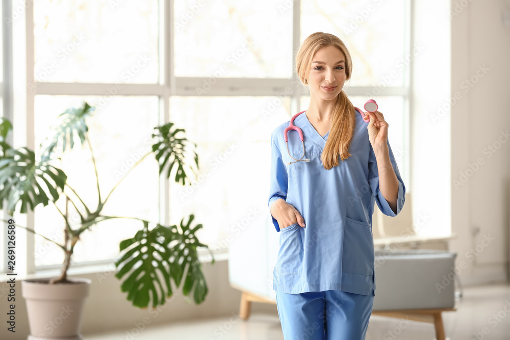 Female medical assistant in clinic Female medical assistant in clinic