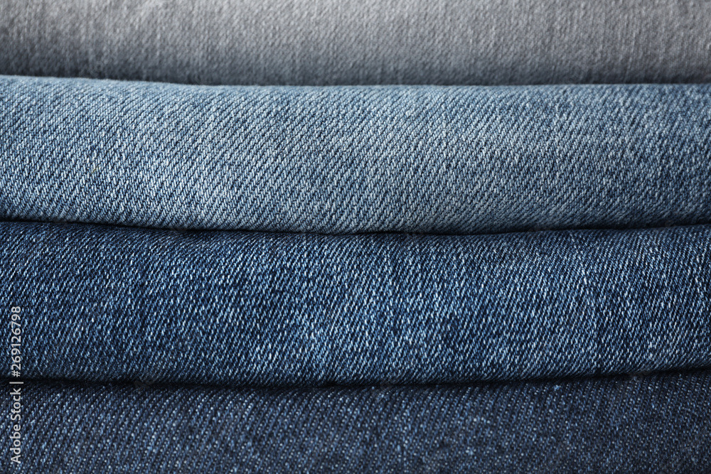 Stacked jeans clothes, closeup view Stacked jeans clothes, closeup view