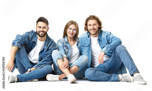 Stylish young people in jeans clothes on white background