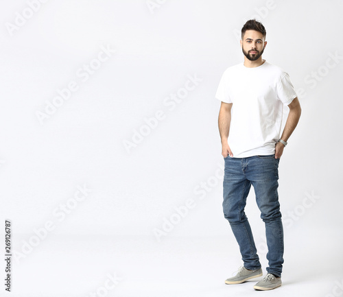 Stylish young man in jeans ...