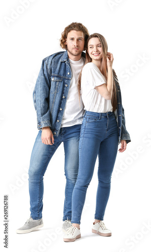Stylish young couple in jeans clothes on white background