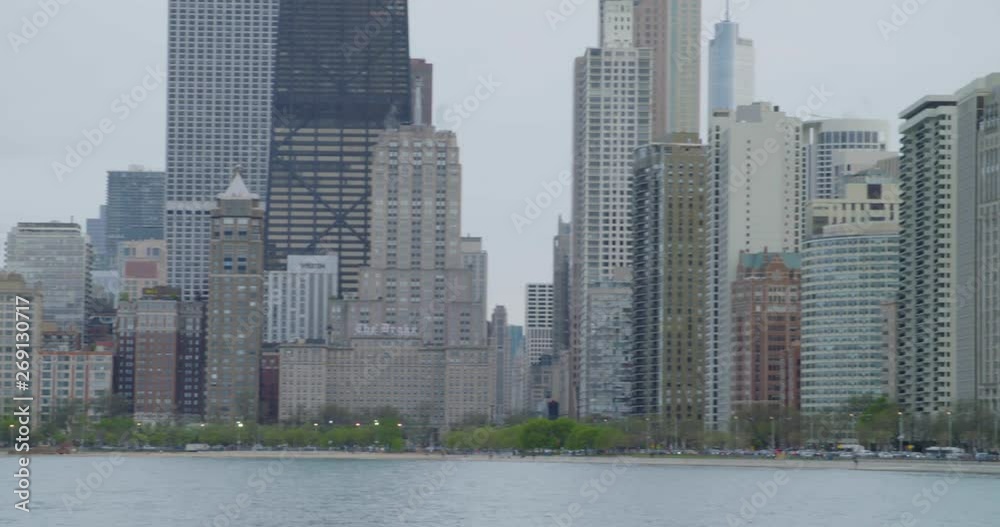 Chicago skyline and lakeshore close up north avenue beach pan left to right Chicago skyline and lakeshore close up north avenue beach pan left to right