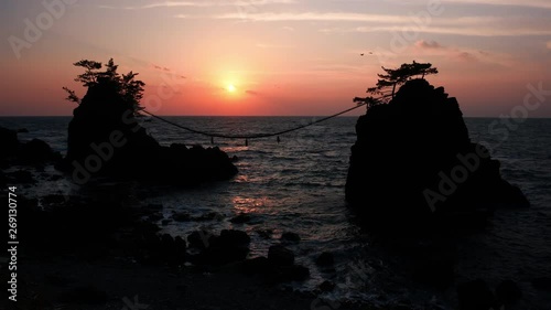 Sunset over Scenic Rocks and a Sea (w/ birds): Hatagoiwa Rocks in Noto Peninsula, Ishikawa Pref., Japan  photo