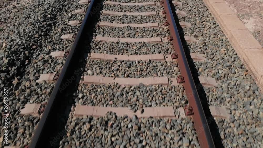 Railway rails, sleepers and ballast in Spain from low altitude with the drone overflown the day in sunshine. Railway rails, sleepers and ballast in Spain from low altitude with the drone overflown the day in sunshine.