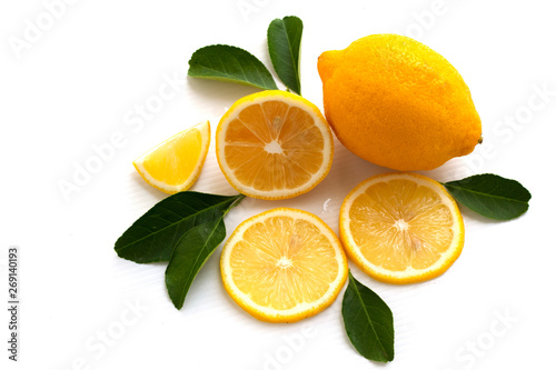 fresh lemon with lime and leaves isolated on white background