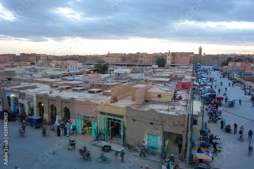 Rissani, Morocco - March 21st, 2019: A view down onto the main street with busy locals during sunset. photo