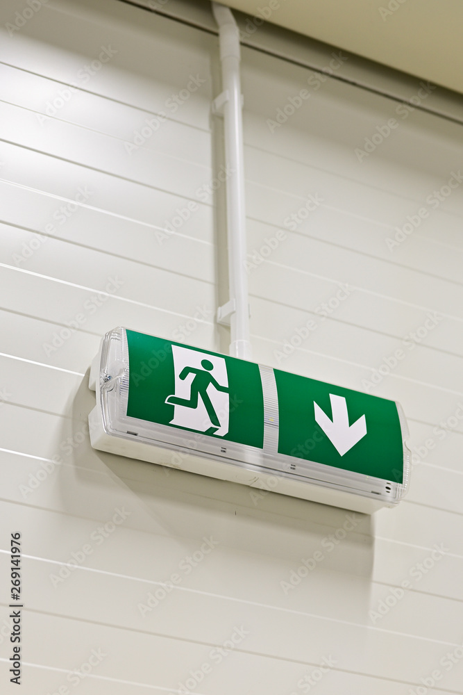 Naklejka premium Emergency luminaire with green information table.