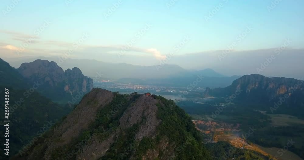 flying over the mountain in Vang Vieng, Laos, clear blue sky, sunset time, panorama view flying over the mountain in Vang Vieng, Laos, clear blue sky, sunset time, panorama view