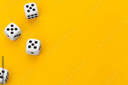 dice on a yellow background