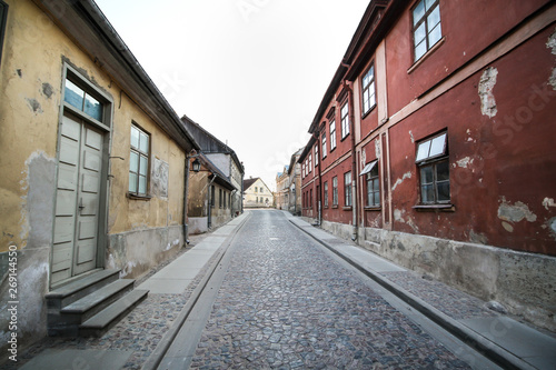 Beautiful old village coutnryside street with bricks and old houses. © Artūrs Stiebriņš