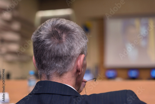 Businessman at business conference room with public giving presentations. Audience at the conference hall. Entrepreneurship club.